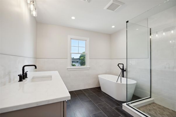Bathroom, Dual Sink Vanities, Free Standing Baths, Glass Shower, Interior, Recessed Lighting, Wood Texture Flooring