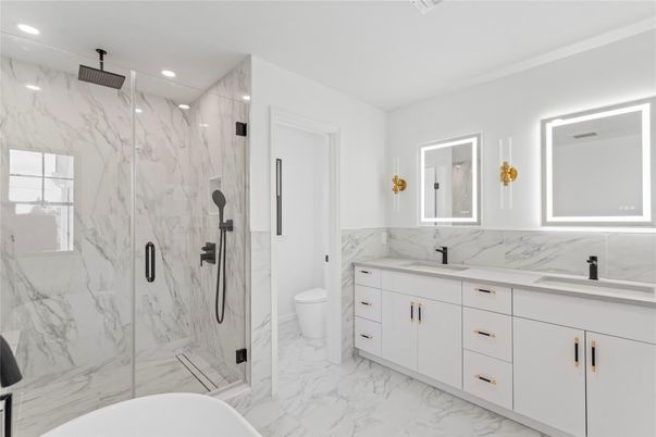 Bathroom, Dual Sink Vanities, Free Standing Baths, Glass Shower, Interior, Marble, Marble Walls, Recessed Lighting