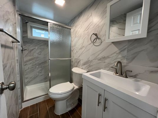 Bathroom, Glass Shower, Interior, Marble Walls, Wood Texture Flooring
