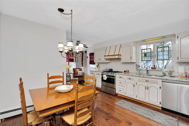 Chandelier, Dining room, Interior, Kitchen, Stainless Steel Appliances, Wood Texture Flooring