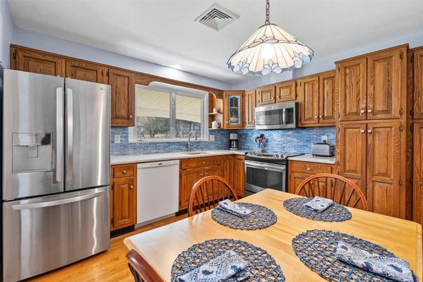 Dining room, Interior, Kitchen, Pendant Lights, Stainless Steel Appliances, Wood Texture Flooring