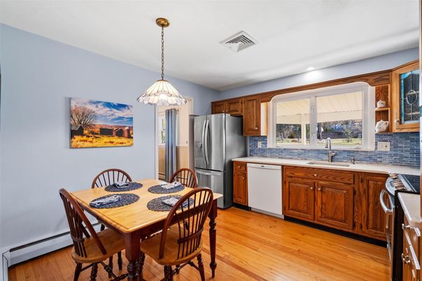 Dining room, Interior, Kitchen, Pendant Lights, Recessed Lighting, Stainless Steel Appliances, Wood Texture Flooring