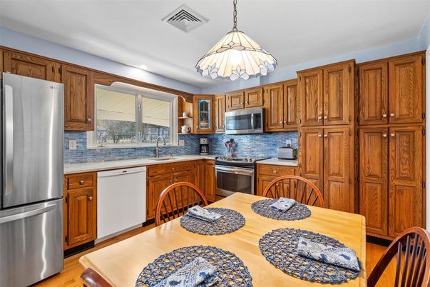 Dining room, Interior, Kitchen, Pendant Lights, Stainless Steel Appliances, Wood Texture Flooring