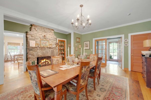 Chandelier, Dining room, Fireplace, Interior, Stone Walls, Wood Texture Flooring