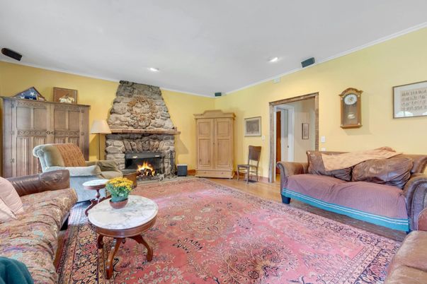 Fireplace, Interior, Living room, Recessed Lighting, Stone Walls, Wood Texture Flooring