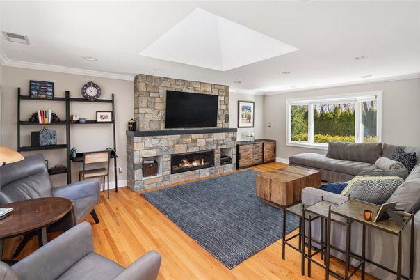 Fireplace, Interior, Living room, Recessed Lighting, Stone Walls, Wood Texture Flooring
