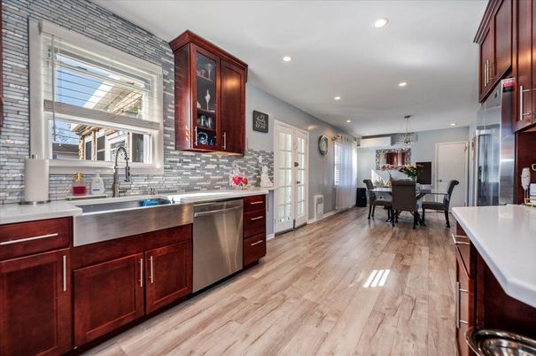 Chandelier, Dining room, Interior, Kitchen, Recessed Lighting, Stainless Steel Appliances, Wood Texture Flooring