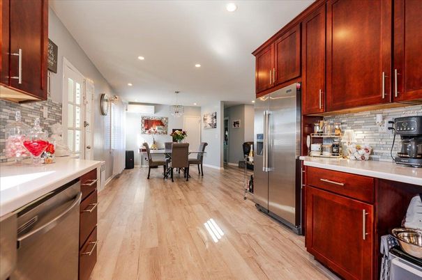 Chandelier, Dining room, Interior, Kitchen, Pendant Lights, Recessed Lighting, Stainless Steel Appliances, Wood Texture Flooring
