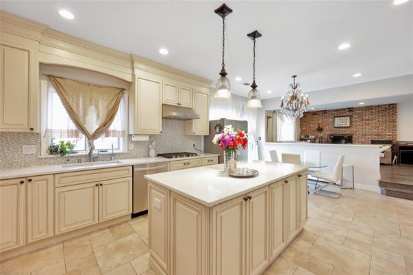 Chandelier, Dining room, Fireplace, Interior, Kitchen, Pendant Lights, Recessed Lighting, Stainless Steel Appliances, Stone Walls