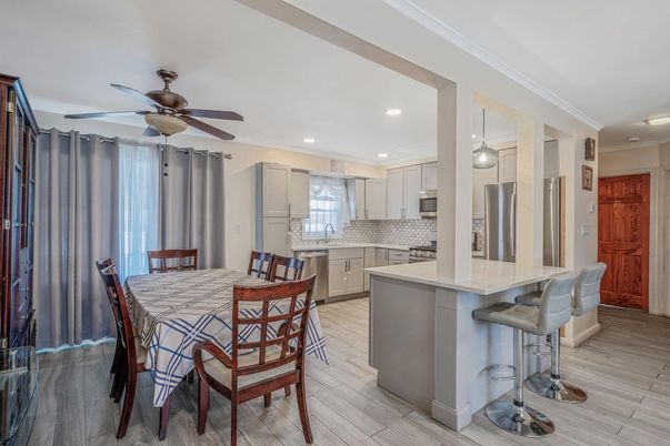 Dining room, Interior, Kitchen, Recessed Lighting, Stainless Steel Appliances, Wood Texture Flooring