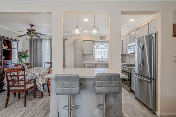 Dining room, Interior, Kitchen, Pendant Lights, Recessed Lighting, Stainless Steel Appliances, Wood Texture Flooring
