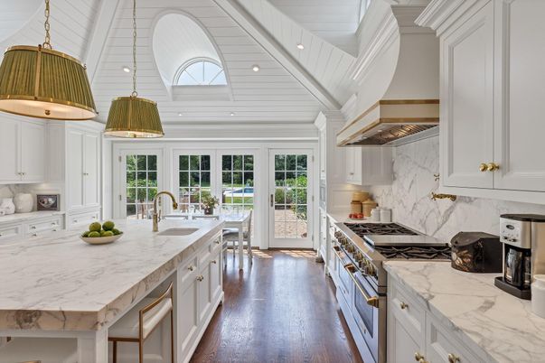 Interior, Kitchen, Marble Walls, Pendant Lights, Recessed Lighting, Stainless Steel Appliances, Wood Texture Flooring