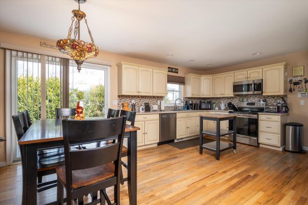 Dining room, Interior, Kitchen, Pendant Lights, Recessed Lighting, Stainless Steel Appliances, Wood Texture Flooring