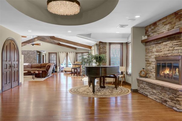 Fireplace, Interior, Living room, Piano, Recessed Lighting, Stone Walls, Wooden Beams, Wood Texture Flooring