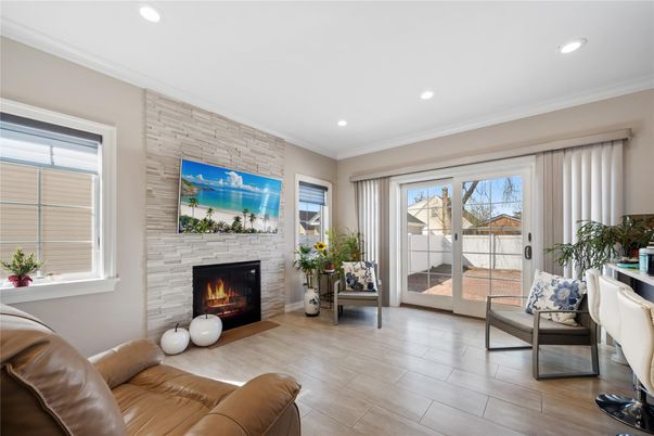 Fireplace, Interior, Living room, Recessed Lighting, Stone Walls, Wood Texture Flooring