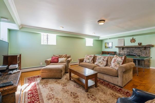 Fireplace, Interior, Living room, Recessed Lighting, Stone Walls, Wood Texture Flooring