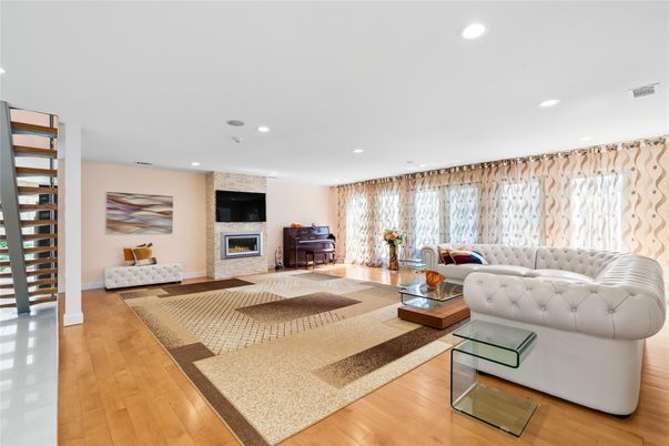 Fireplace, Interior, Living room, Piano, Recessed Lighting, Wood Texture Flooring
