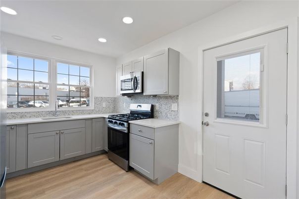 Interior, Kitchen, Recessed Lighting, Stainless Steel Appliances, Wood Texture Flooring