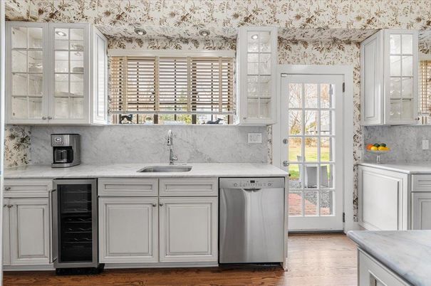 Interior, Kitchen, Marble Walls, Recessed Lighting, Stainless Steel Appliances, Wood Texture Flooring