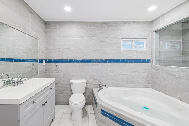 Bathroom, Dual Sink Vanities, Glass Shower, Interior, Marble, Marble Walls, Recessed Lighting