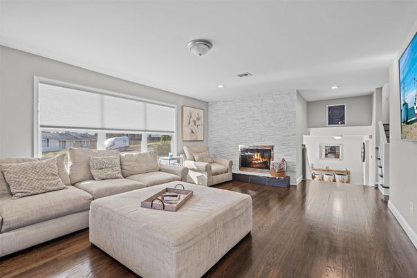 Fireplace, Interior, Living room, Recessed Lighting, Stone Walls, Wood Texture Flooring
