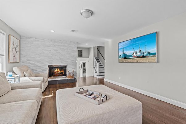 Fireplace, Interior, Living room, Recessed Lighting, Stone Walls, Wood Texture Flooring
