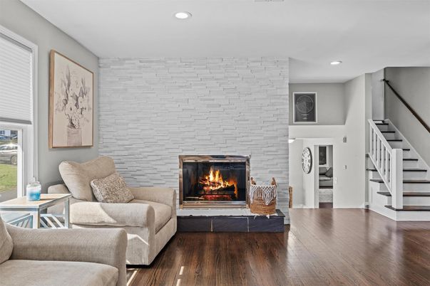 Fireplace, Interior, Living room, Recessed Lighting, Stone Walls, Wood Texture Flooring