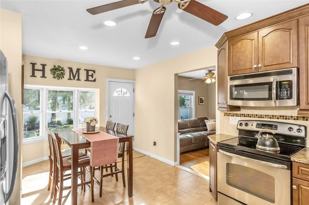 Dining room, Interior, Kitchen, Recessed Lighting, Stainless Steel Appliances, Wood Texture Flooring