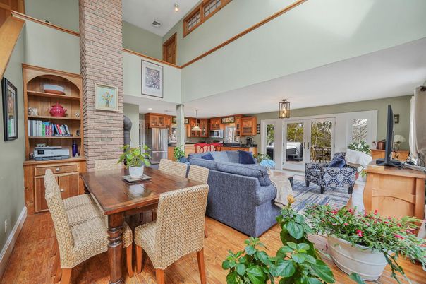 Dining room, Fireplace, Interior, Kitchen, Living room, Recessed Lighting, Stone Walls, Wood Texture Flooring