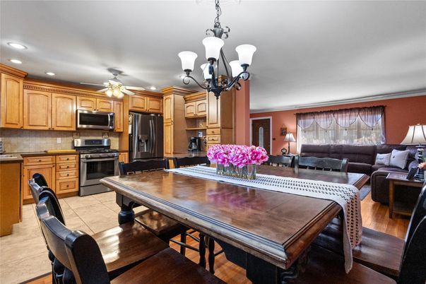 Chandelier, Dining room, Interior, Kitchen, Living room, Recessed Lighting, Stainless Steel Appliances, Wood Texture Flooring