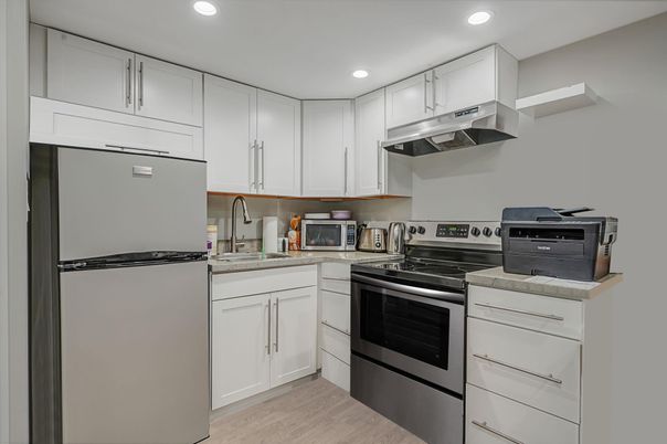 Interior, Kitchen, Recessed Lighting, Stainless Steel Appliances, Wood Texture Flooring