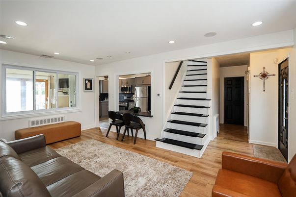 Dining room, Interior, Kitchen, Living room, Recessed Lighting, Stainless Steel Appliances, Wood Texture Flooring