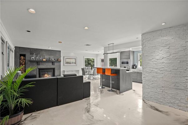 Dining room, Fireplace, Interior, Kitchen, Living room, Pendant Lights, Recessed Lighting, Stainless Steel Appliances, Stone Walls