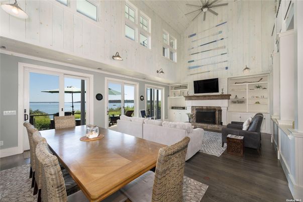 Dining room, Fireplace, Interior, Living room, Pendant Lights, Water, Wood Texture Flooring