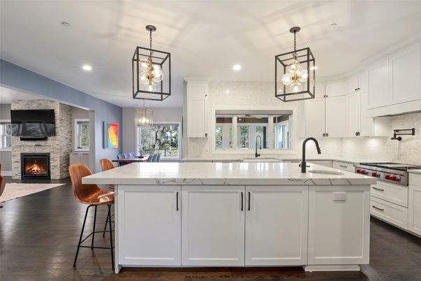 Dining room, Fireplace, Interior, Kitchen, Pendant Lights, Recessed Lighting, Stainless Steel Appliances, Stone Walls, Wood Texture Flooring
