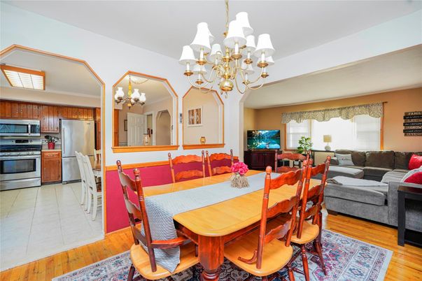 Chandelier, Dining room, Interior, Kitchen, Living room, Stainless Steel Appliances, Wood Texture Flooring