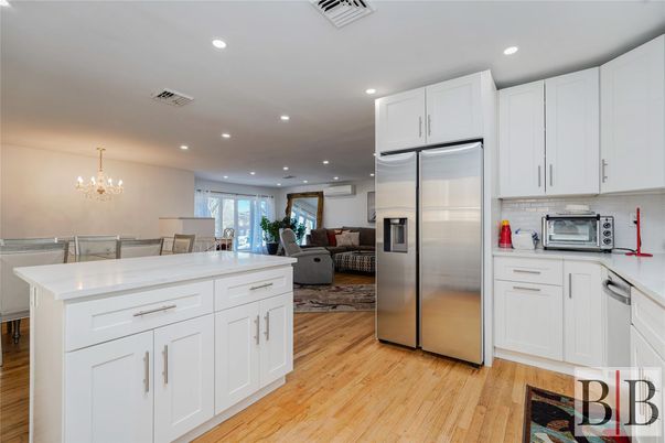 Chandelier, Dining room, Interior, Kitchen, Living room, Recessed Lighting, Stainless Steel Appliances, Wood Texture Flooring