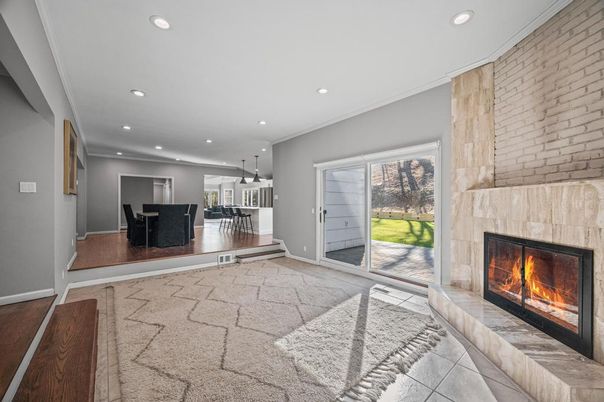 Dining room, Fireplace, Interior, Pendant Lights, Recessed Lighting, Stone Walls, Wood Texture Flooring