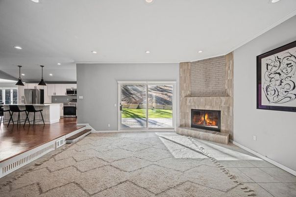 Fireplace, Interior, Kitchen, Pendant Lights, Recessed Lighting, Stainless Steel Appliances, Stone Walls