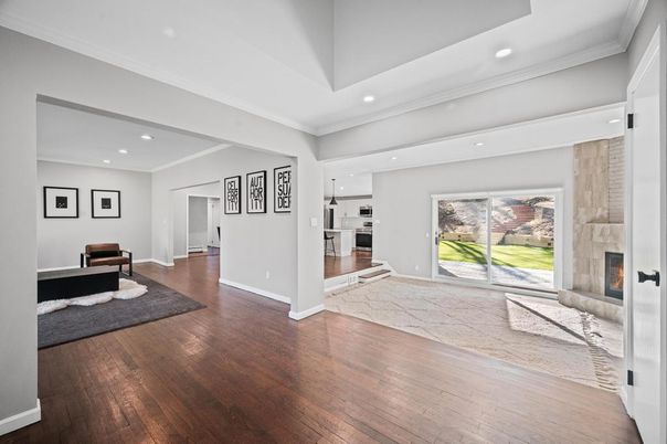 Fireplace, Interior, Kitchen, Recessed Lighting, Stainless Steel Appliances, Wood Texture Flooring