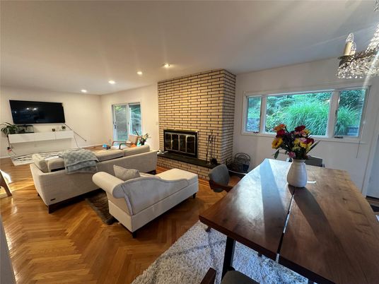 Dining room, Fireplace, Interior, Living room, Recessed Lighting, Stone Walls, Wood Texture Flooring