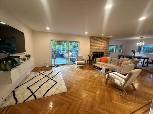 Chandelier, Dining room, Fireplace, Interior, Living room, Recessed Lighting, Stone Walls, Wood Texture Flooring