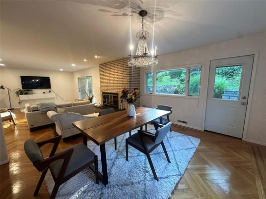 Chandelier, Dining room, Fireplace, Interior, Living room, Recessed Lighting, Stone Walls, Wood Texture Flooring