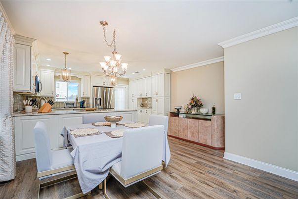 Chandelier, Dining room, Interior, Kitchen, Pendant Lights, Recessed Lighting, Stainless Steel Appliances, Wood Texture Flooring