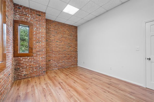 Empty room, Interior, Recessed Lighting, Stone Walls, Wood Texture Flooring