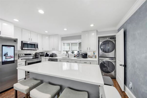 Interior, Kitchen, Recessed Lighting, Stainless Steel Appliances, Washer, Wood Texture Flooring