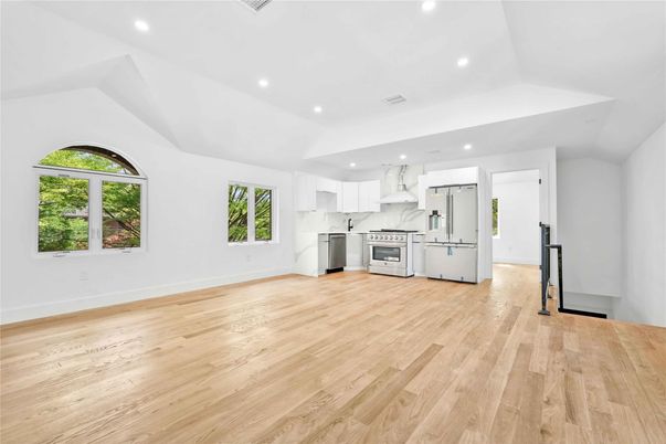 Interior, Kitchen, Marble Walls, Recessed Lighting, Stainless Steel Appliances, Wood Texture Flooring