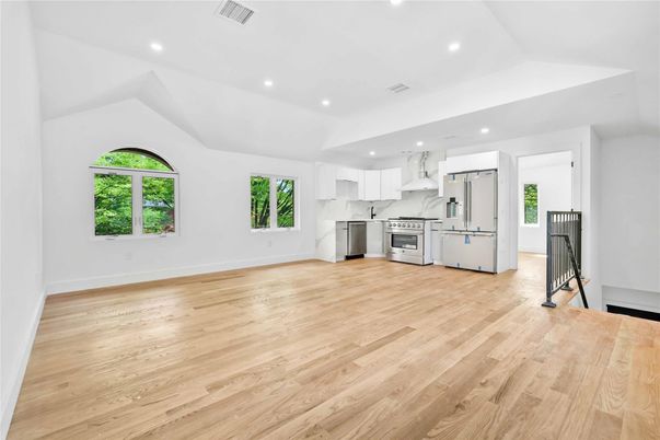 Interior, Kitchen, Marble Walls, Recessed Lighting, Stainless Steel Appliances, Wood Texture Flooring