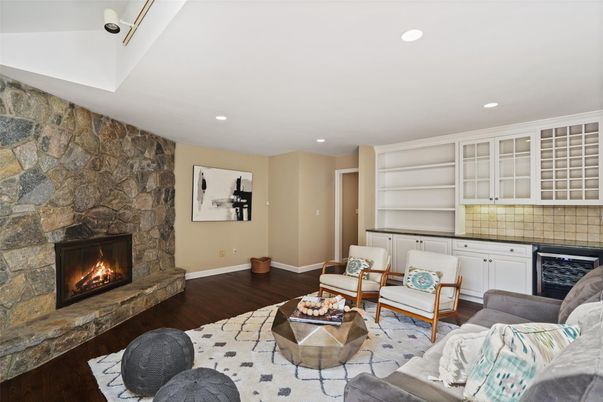 Fireplace, Interior, Living room, Recessed Lighting, Stone Walls, Wood Texture Flooring