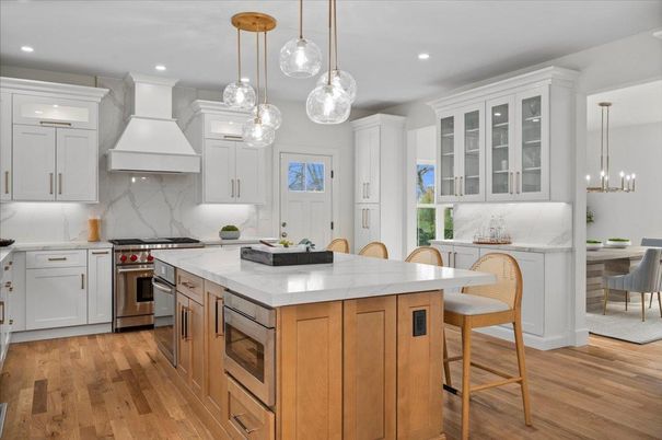 Dining room, Interior, Kitchen, Marble Walls, Pendant Lights, Recessed Lighting, Stainless Steel Appliances, Wood Texture Flooring